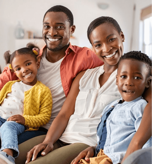 A smiling family seated together